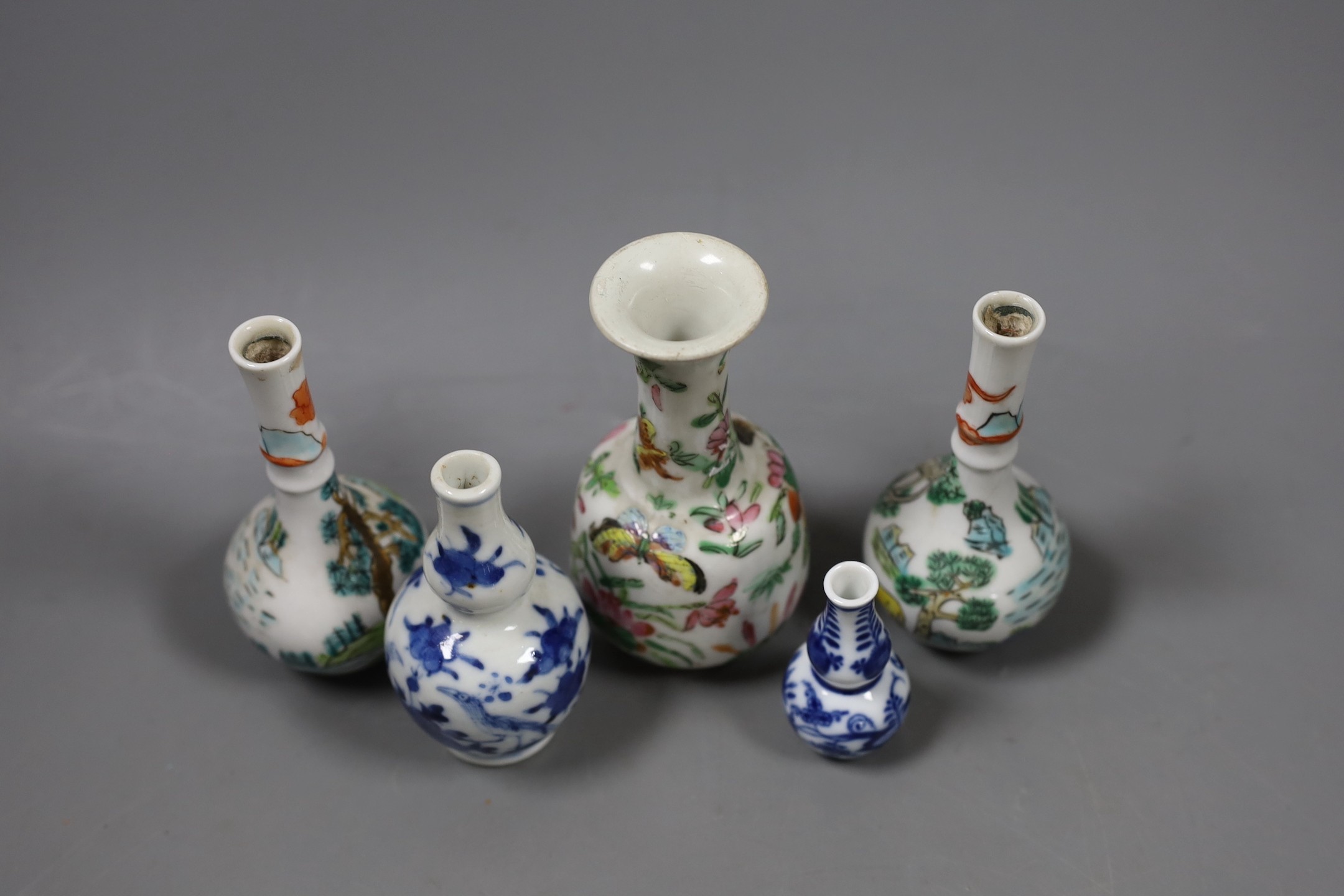 A group of Chinese miniature porcelain bottle vase, 19th/20th century and a Meissen miniature onion pattern vase. Tallest 12cm